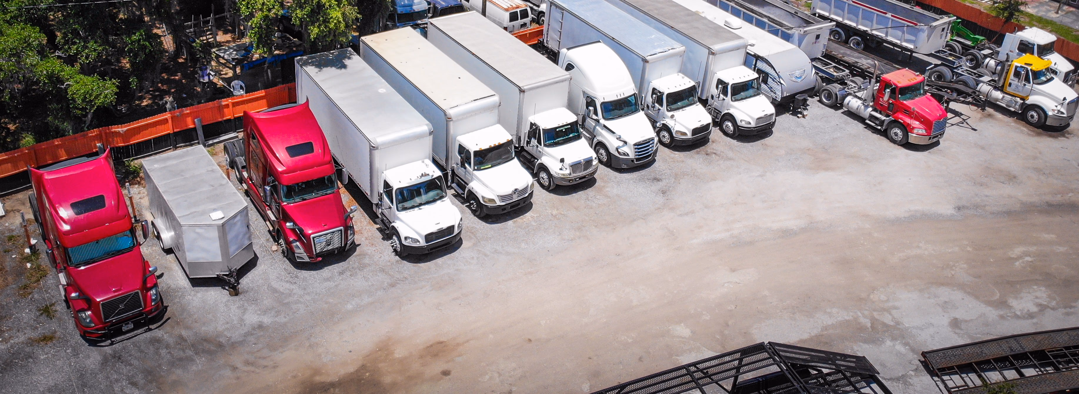 Commercial box trucks parked at GO Storage USA in Davenport, Florida