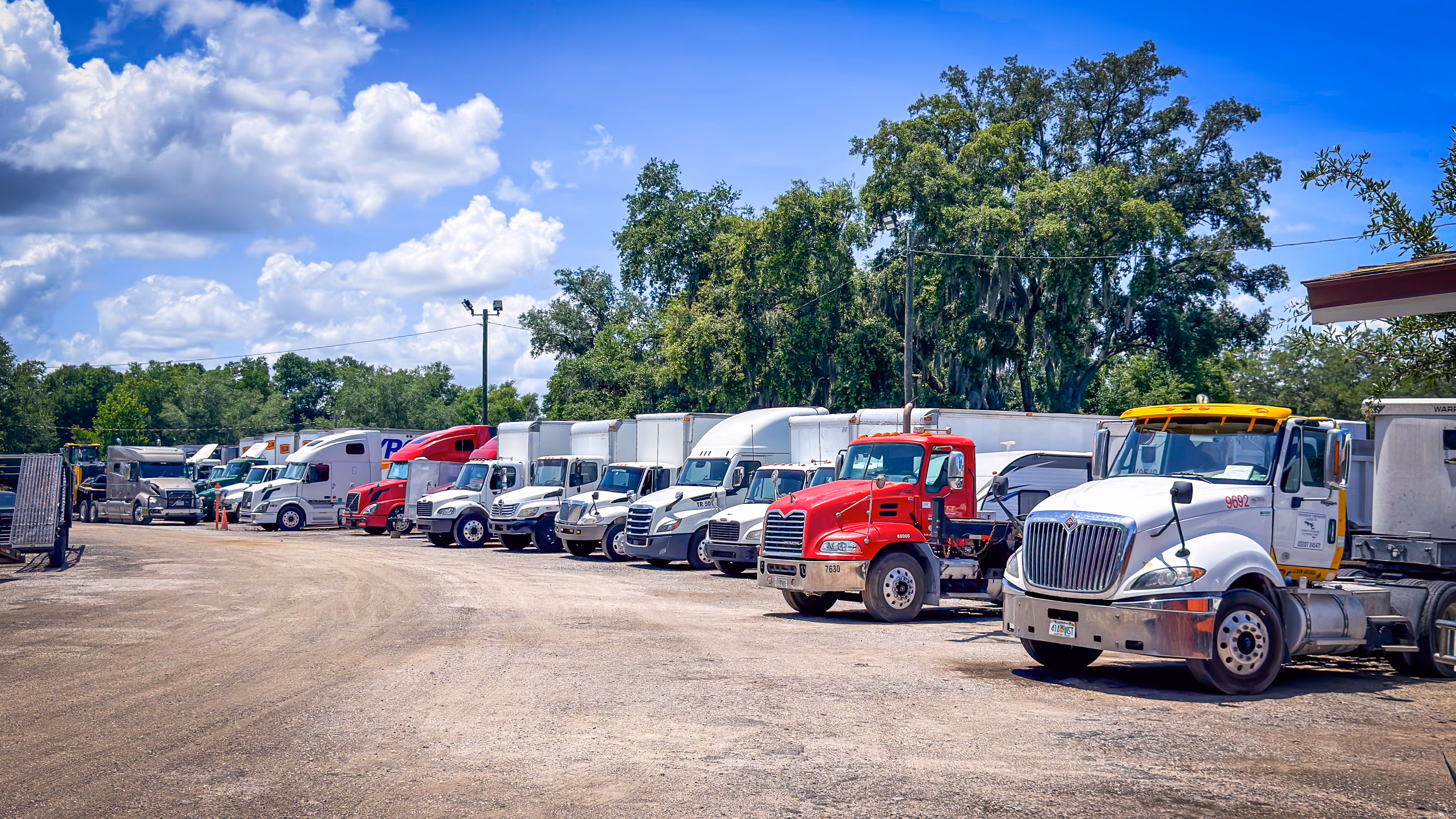 Lane of parked semi trucks at GO Storage USA, Davenport FL
