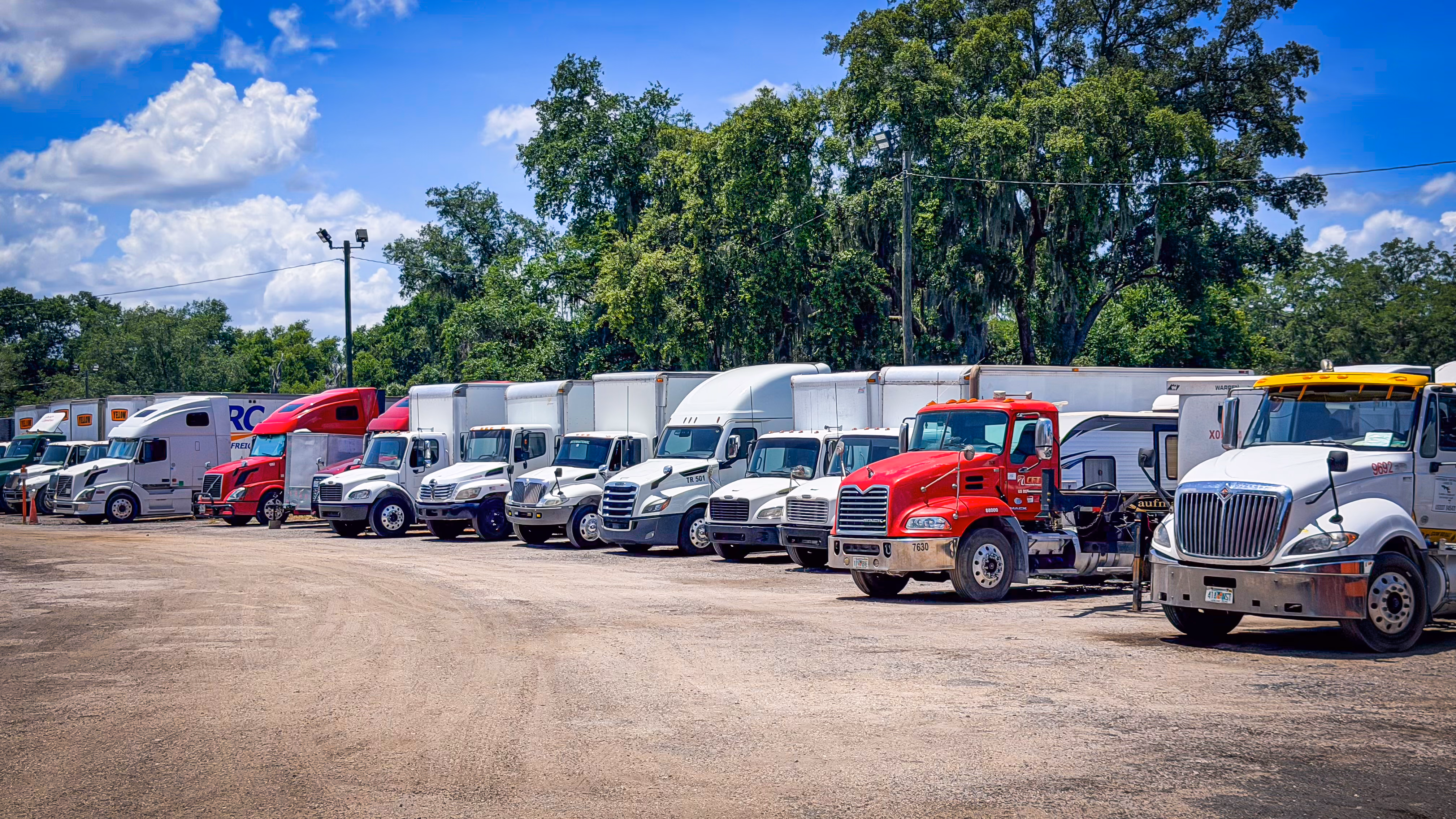 Ground-level row of semi trucks at GO Storage USA, Davenport FL
