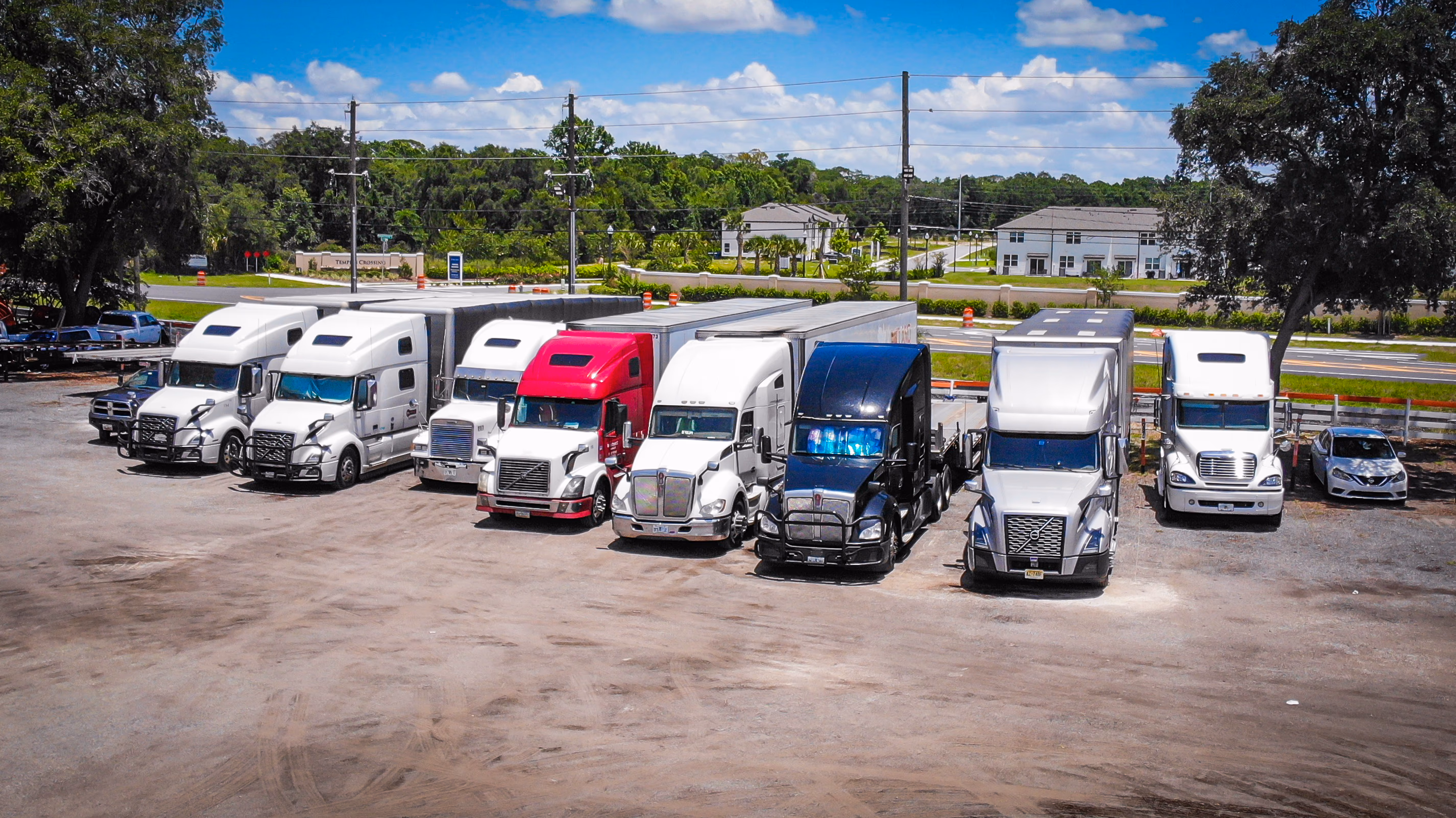 Row of semi trucks parked at GO Storage USA, a commercial truck parking facility in Davenport, Florida